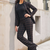 Woman wearing matching Black Brown Plaid straight-leg pants and Classic Blazer with a black top and heels outdoors