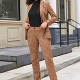 Woman wearing Camel Mini Houndstooth straight-leg Dress Pant Yoga Pants with matching blazer and black turtleneck outdoors