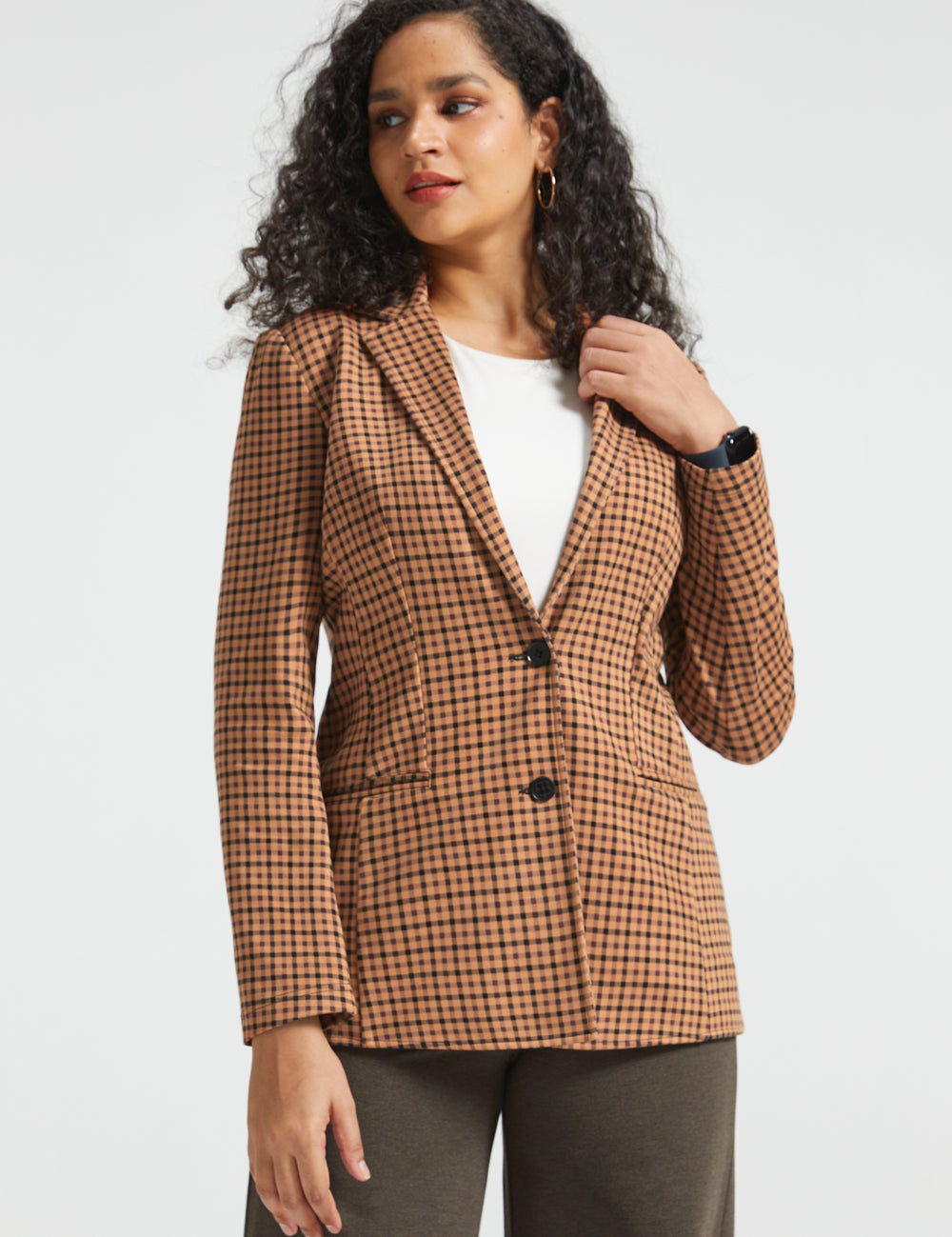 Woman wearing Camel Mini Houndstooth Classic Blazer buttoned over a white top, front three-quarter view