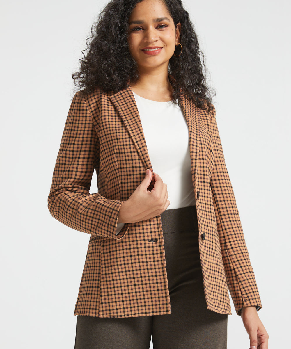 Woman wearing Camel Mini Houndstooth Classic Blazer open over a white top with brown wide-leg pants