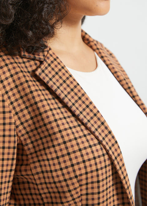 Close-up of Camel Mini Houndstooth blazer showing the notched lapel and camel-and-black check pattern
