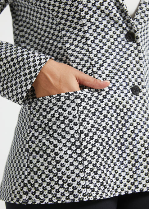 Close-up of hand inside the functional welt pocket of the Black Ivory Catstooth Classic Blazer